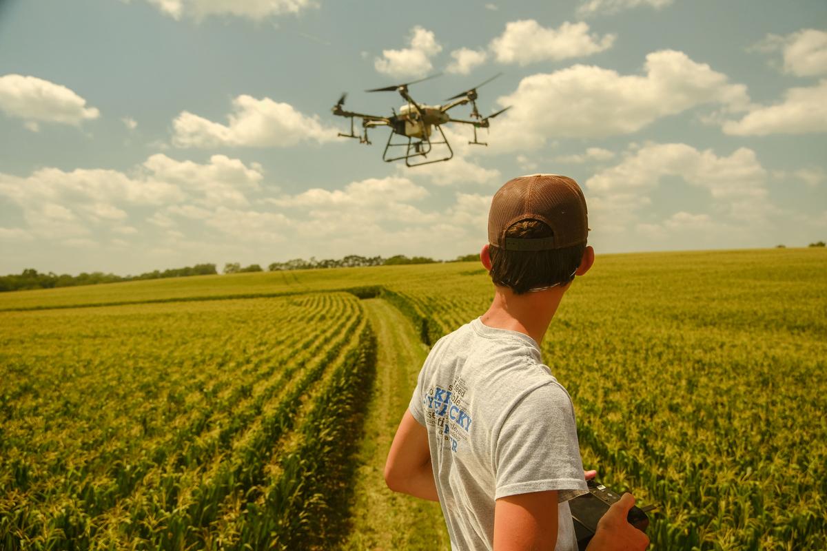 Man in field with a drone